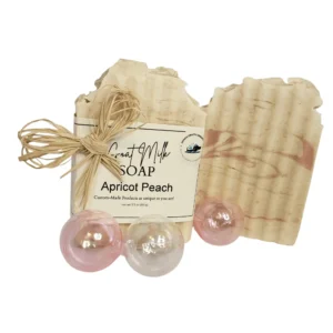 Goat milk soap with decorative pink spheres.