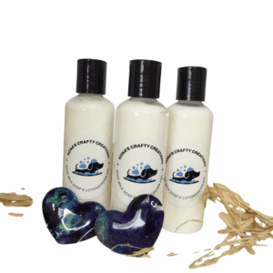 Three lotion bottles with two heart soaps.