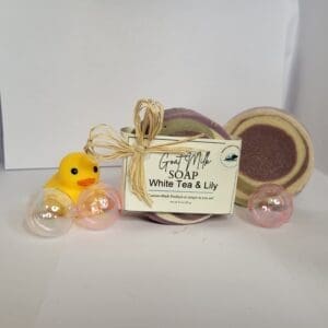Goat milk soap with rubber duck and bubbles.