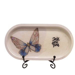 Decorative tray with butterfly and motivational text.
