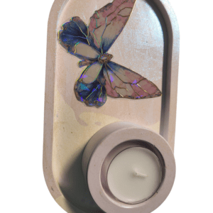 Butterfly candle holder with tealight candle.